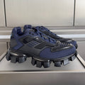 Prada unisex sneaker in dark blue with black chunky tread sole and lace-up upper