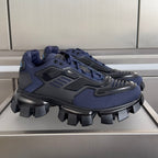 Prada unisex sneaker in dark blue with black chunky tread sole and lace-up upper
