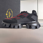 Unisex luxury shoes, dark upper with red accents and padded heel, chunky tread sole