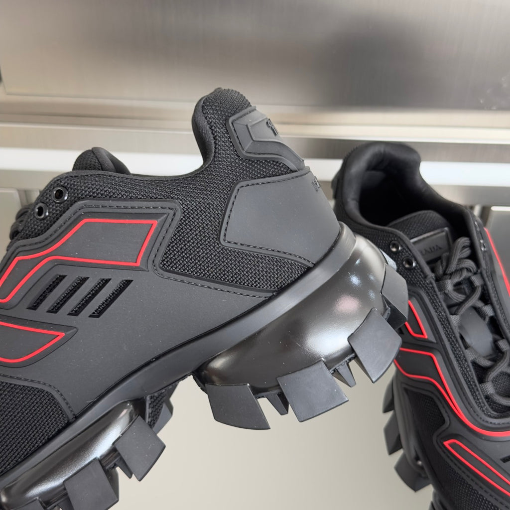 Unisex luxury shoes, close-up of dark side and heel with red trim and lug outsole