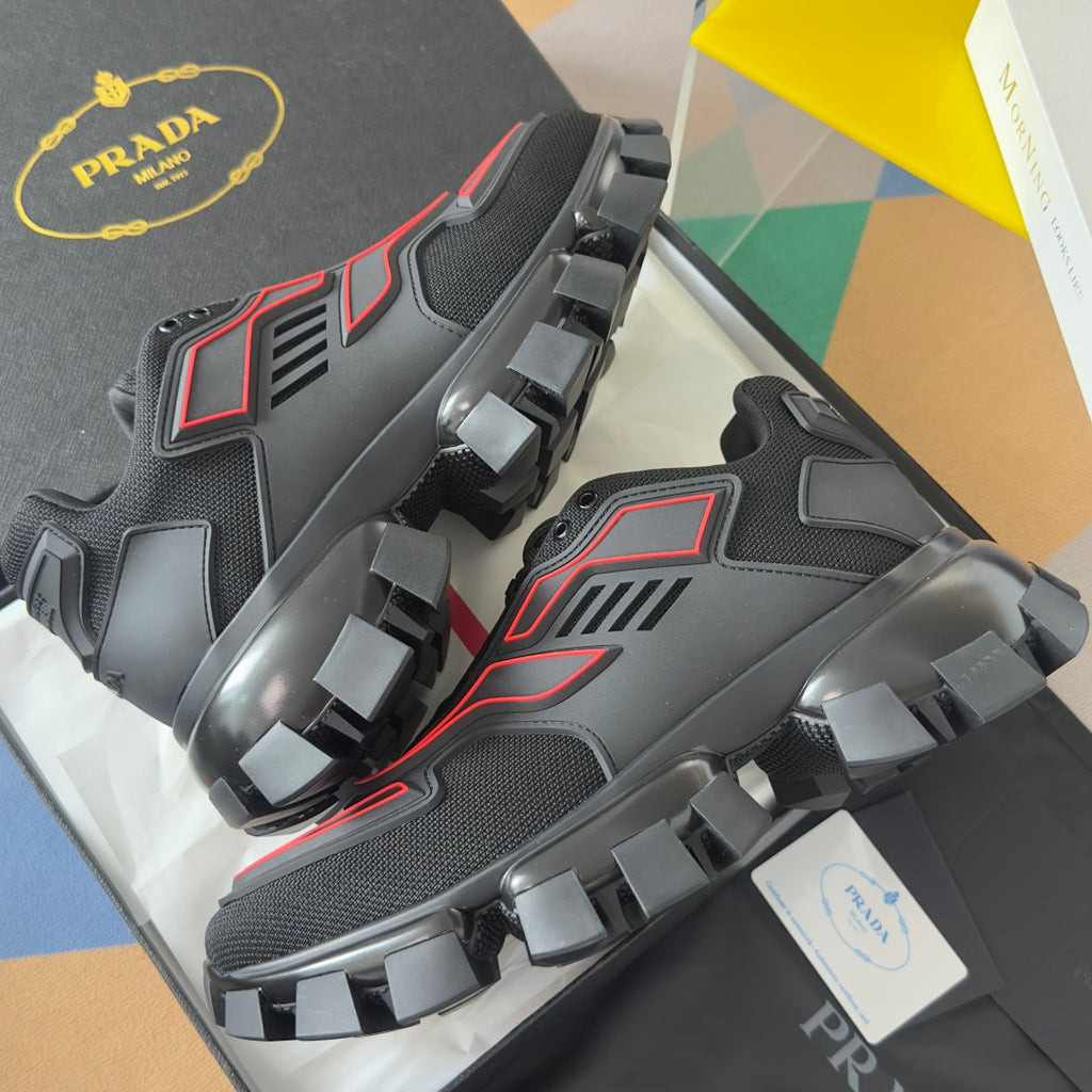 Unisex luxury shoes, side view of dark sneaker with red trim and oversized lug sole