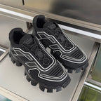 Prada unisex sneakers, black upper with white accents and thick off-road traction sole