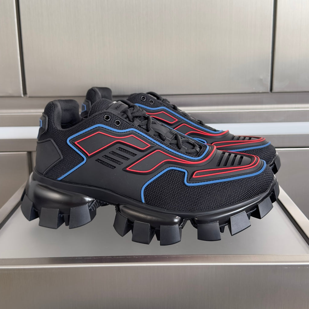 Prada unisex sneakers with dark mesh upper, blue and red trim, chunky lug sole