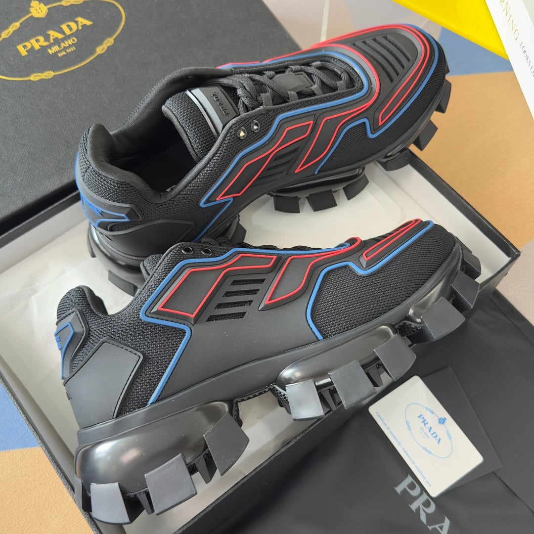 Prada unisex sneakers showing mesh panels, blue and red accents, and thick traction sole