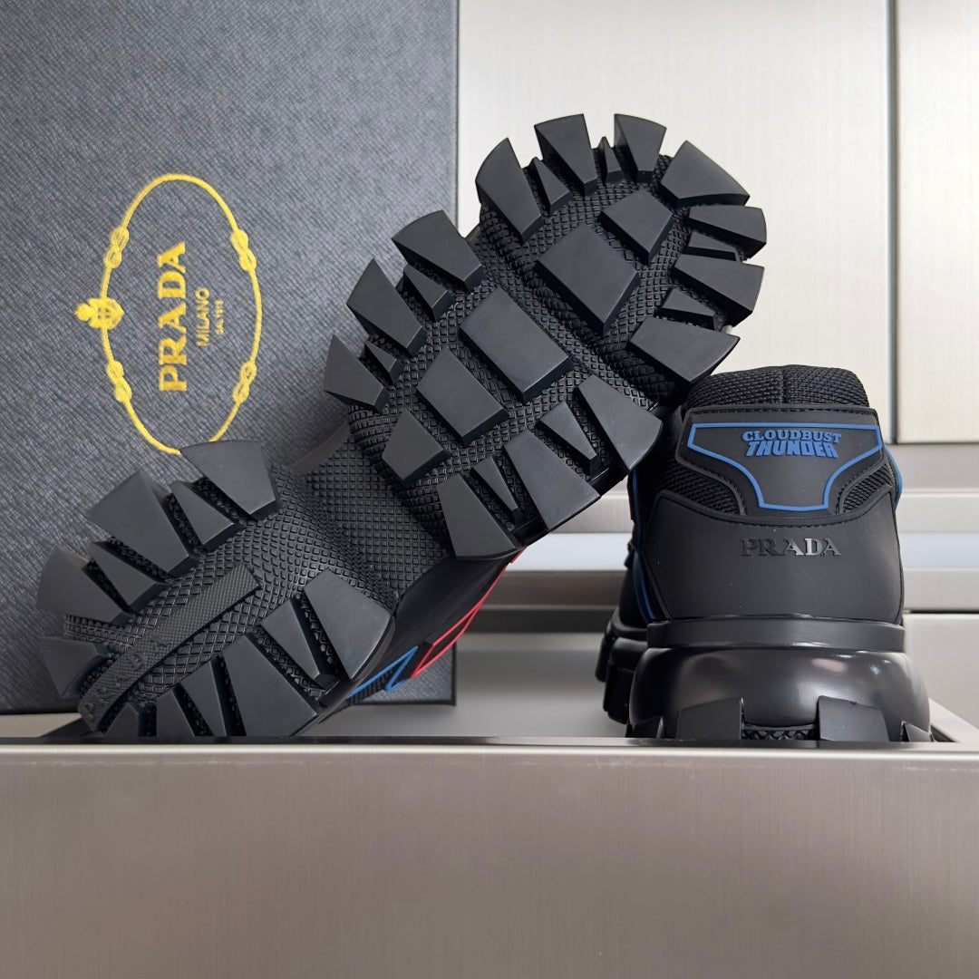 Prada unisex sneaker outsole and heel, showing deep lug tread and side branding patch