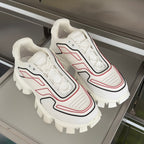 White unisex sneakers, lace-up with red and black trim and rugged lug sole