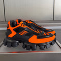 Prada unisex sneakers, black and orange, chunky tread, lace-up front.