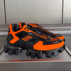 Prada unisex sneakers, black and orange, chunky tread, lace-up front.