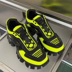 Neon green and black lace-up Prada sneakers with chunky heel and studded sole