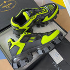 Neon green and black Prada sneakers with chunky sole and lace hook detail
