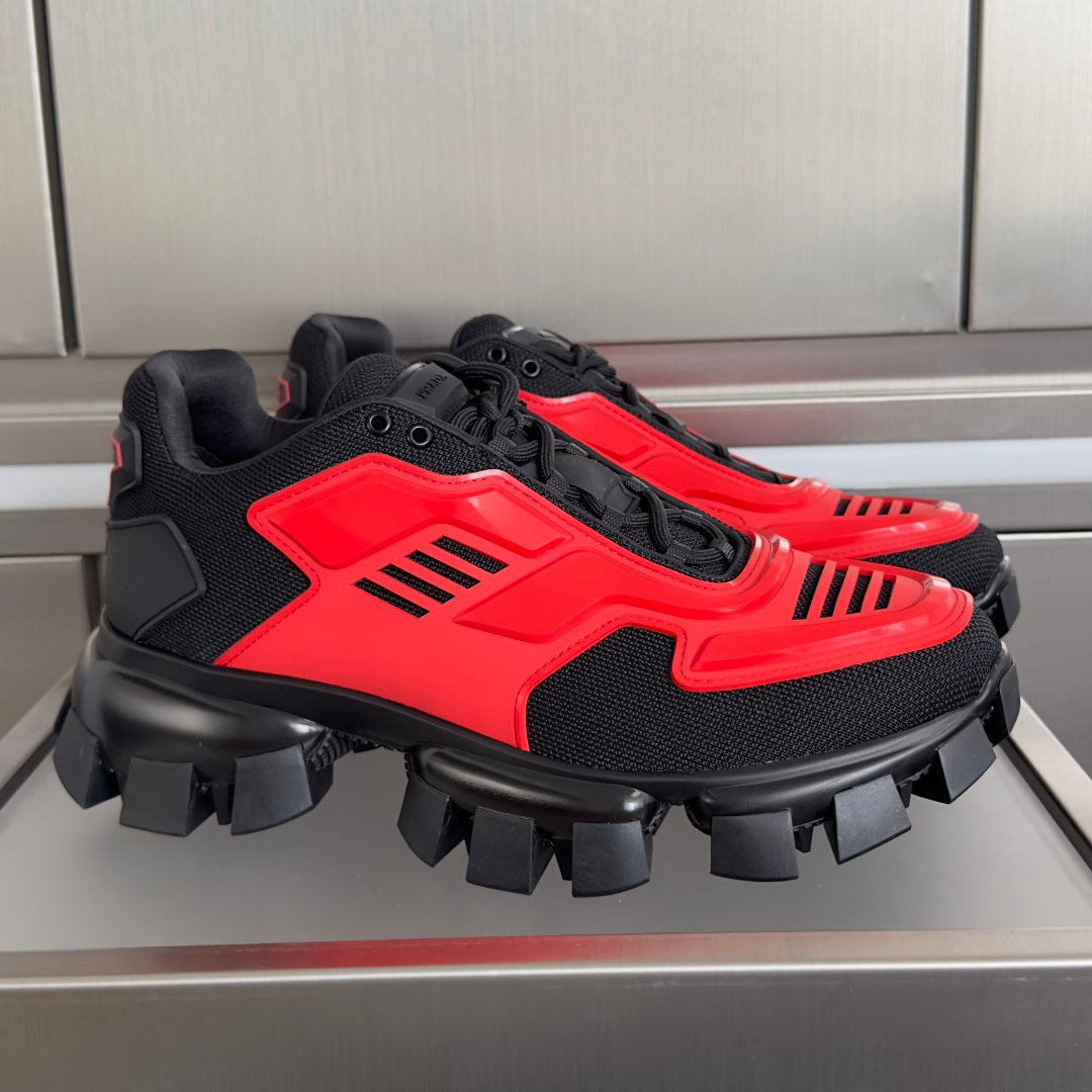 Prada unisex chunky sneakers, black with bright red panels and treaded sole.