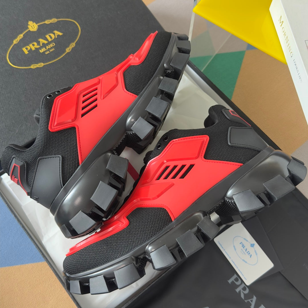 Prada unisex sneakers, close angle on red-and-black chunky platform sole
