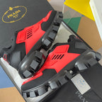 Prada unisex sneakers, black and red uppers with rugged rocker sole and lugs.
