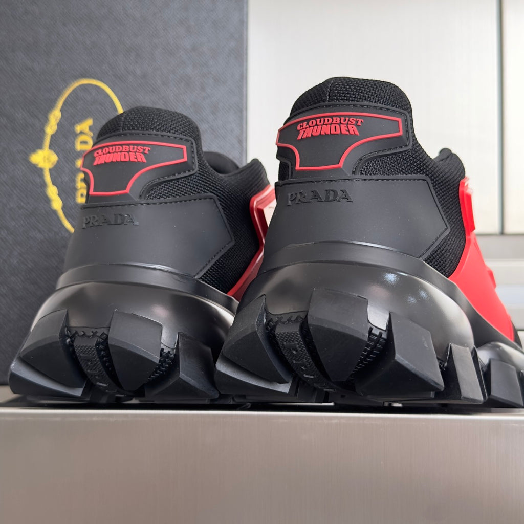 Prada unisex sneakers, heel view in black with red trim and chunky sole