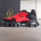 Prada unisex chunky sneakers in black and red with rugged black outsole.
