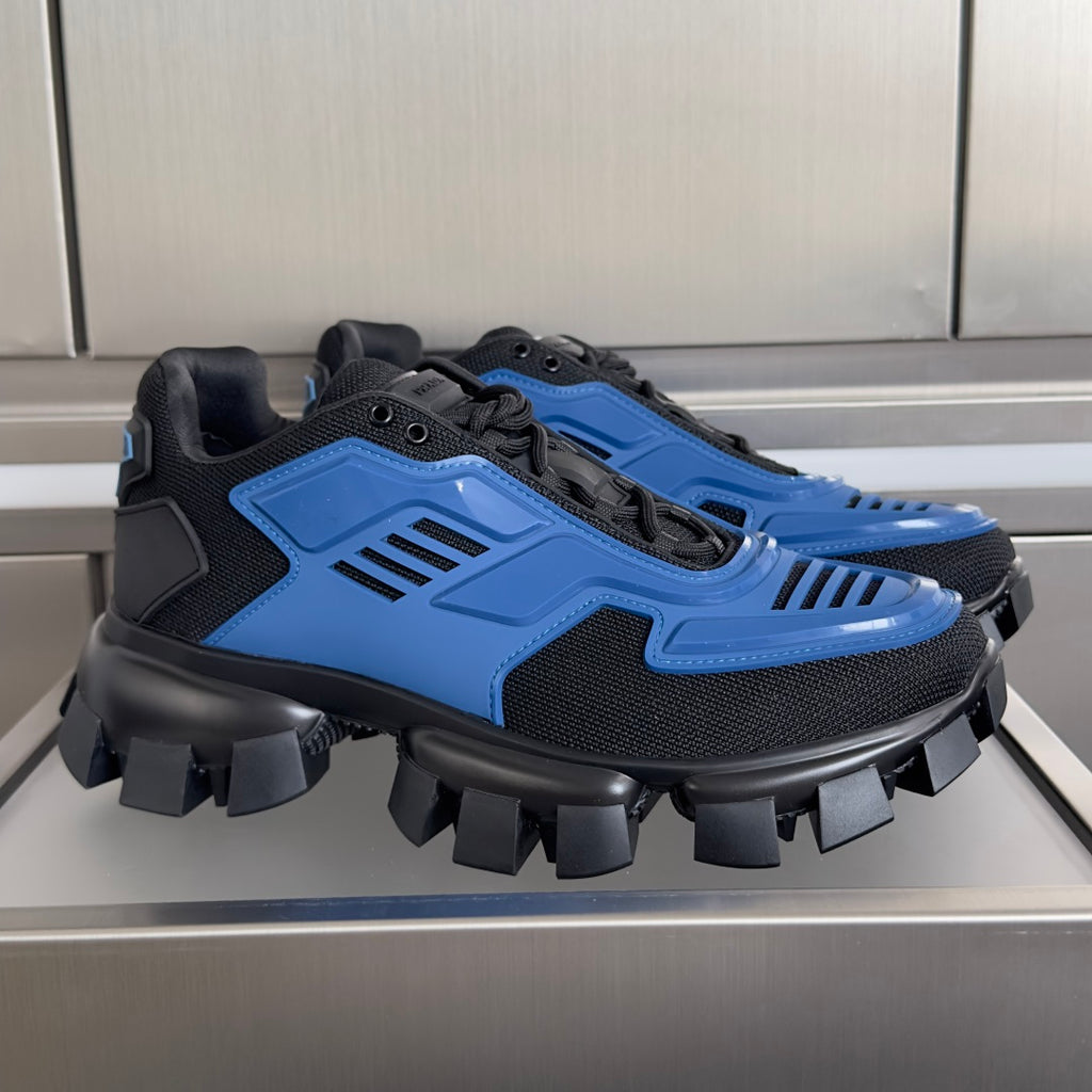 Chunky blue and black unisex sneakers with lace-up uppers and spiked rubber sole