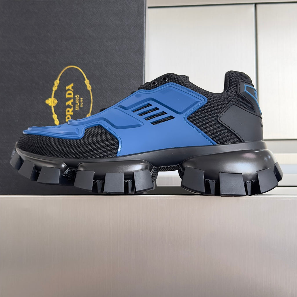 Blue and dark gray lace-up sneakers with thick platform and studded tread sole