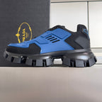 Blue and dark gray lace-up sneakers with thick platform and studded tread sole