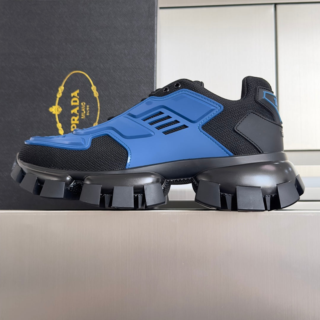 Blue and dark gray lace-up sneakers with thick platform and studded tread sole