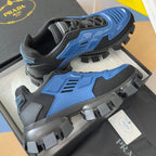 Blue and gray lace-up sneakers with sculpted platform sole and textured upper panels