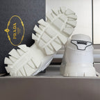 White sneakers with back logos and tall lug soles on display