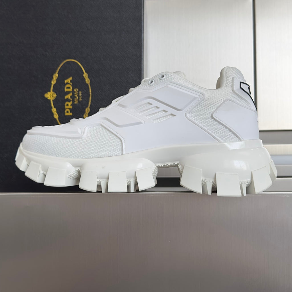 White Prada unisex sneaker with thick tread sole and side logo patch