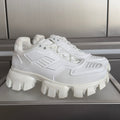 White chunky sneaker with raised lug sole and lace-up front