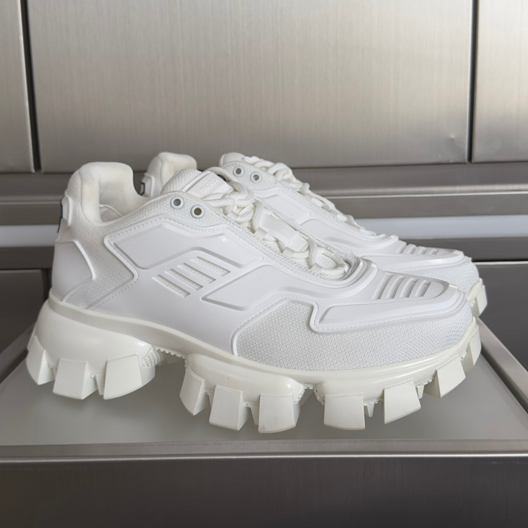 White chunky sneaker with raised lug sole and lace-up front