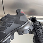 Prada unisex sneaker detail: dark mesh and molded quarter panel with red logo trim