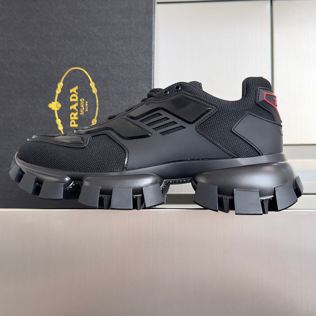 Prada unisex sneakers, dark upper with padded collar, chunky tread sole, lace-up