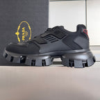 Black Prada unisex sneakers with strap-like panels and thick tread lug sole