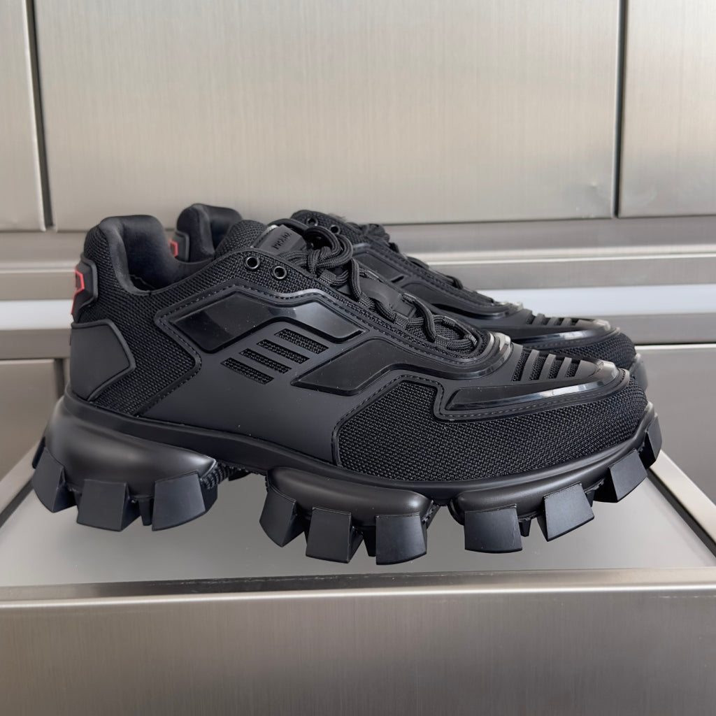 Black Prada unisex sneakers with chunky rubber lug sole and mesh uppers
