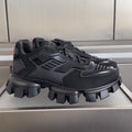 Black Prada unisex sneakers with chunky rubber lug sole and mesh uppers