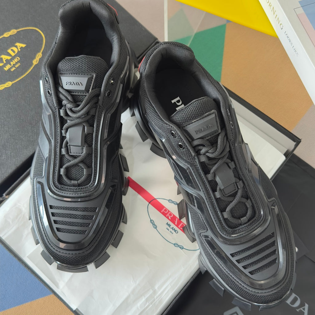 Prada unisex sneakers with dark mesh and molded panels, chunky sole, lace-up