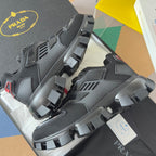 Prada unisex sneakers in dark gray, side view with large lug tread and lace-up