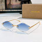 Bvlgari gold-tone sunglasses with light blue lenses and angular frames
