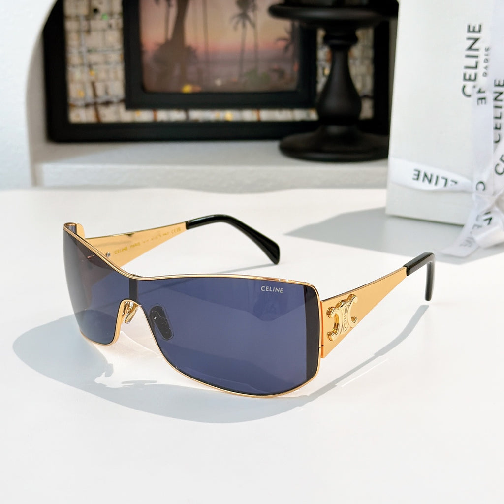 Celine sunglasses with gold frame and blue tinted lenses, cat-eye shield shape