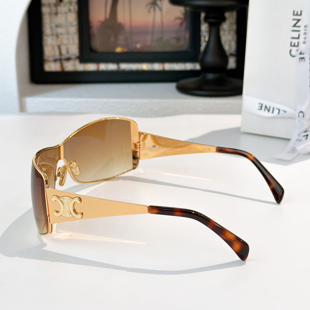 Celine sunglasses with gold frame and warm amber tinted lenses, tortoiseshell temples