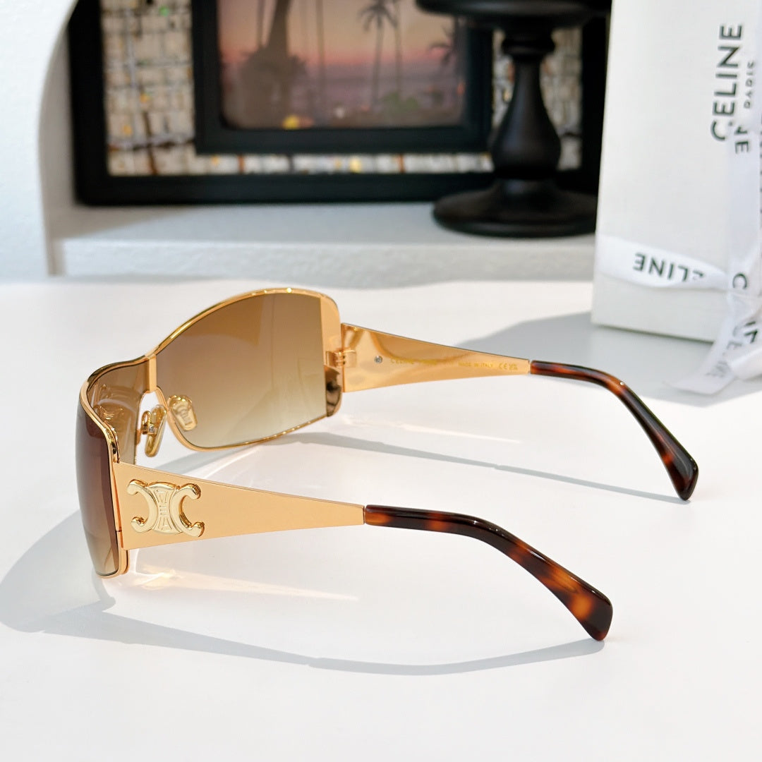 Celine sunglasses with gold frame and warm amber tinted lenses, tortoiseshell temples