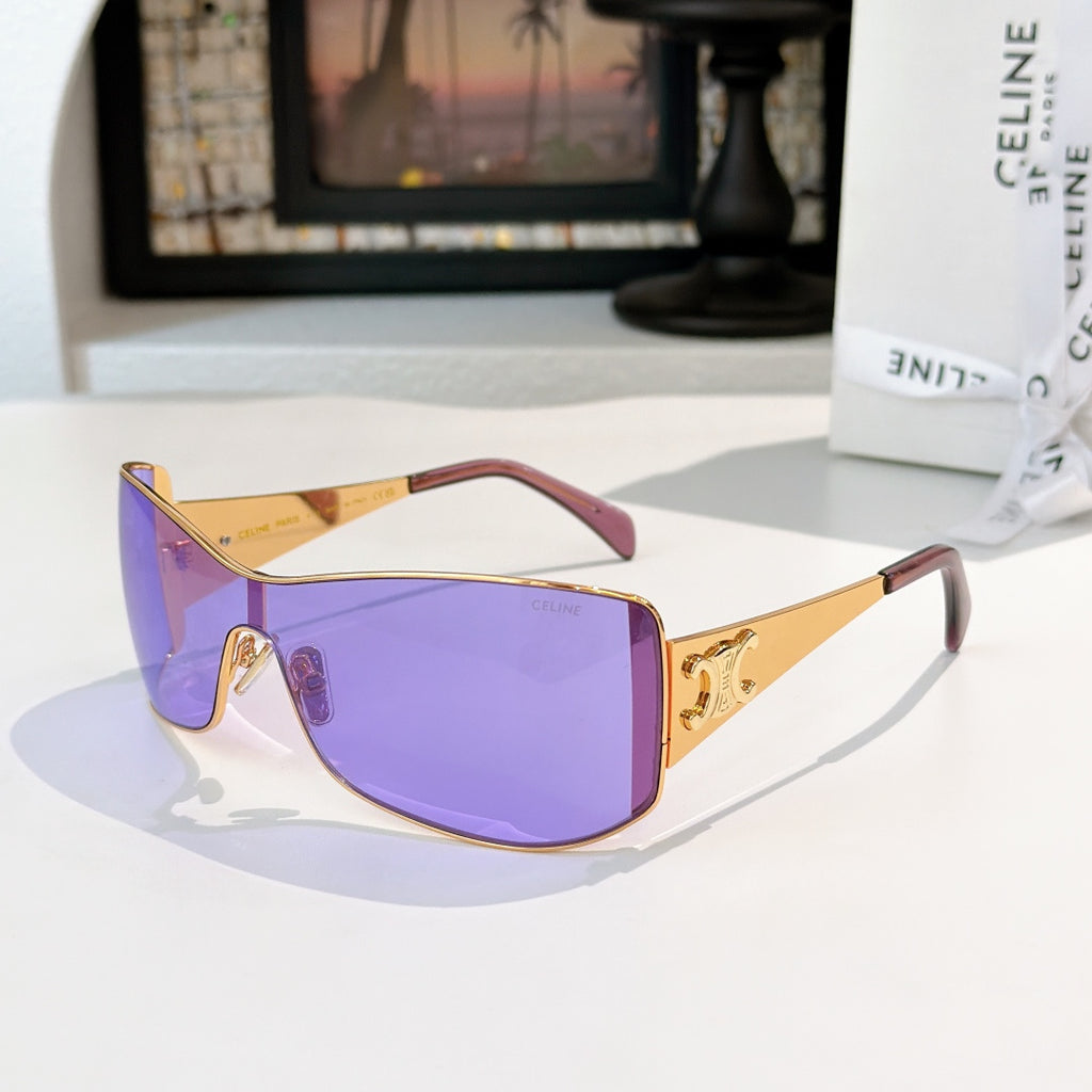 Celine sunglasses with gold frame and purple tinted lenses, cat-eye shield shape