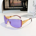 Celine sunglasses with gold frame and purple tinted lenses, cat-eye shield shape