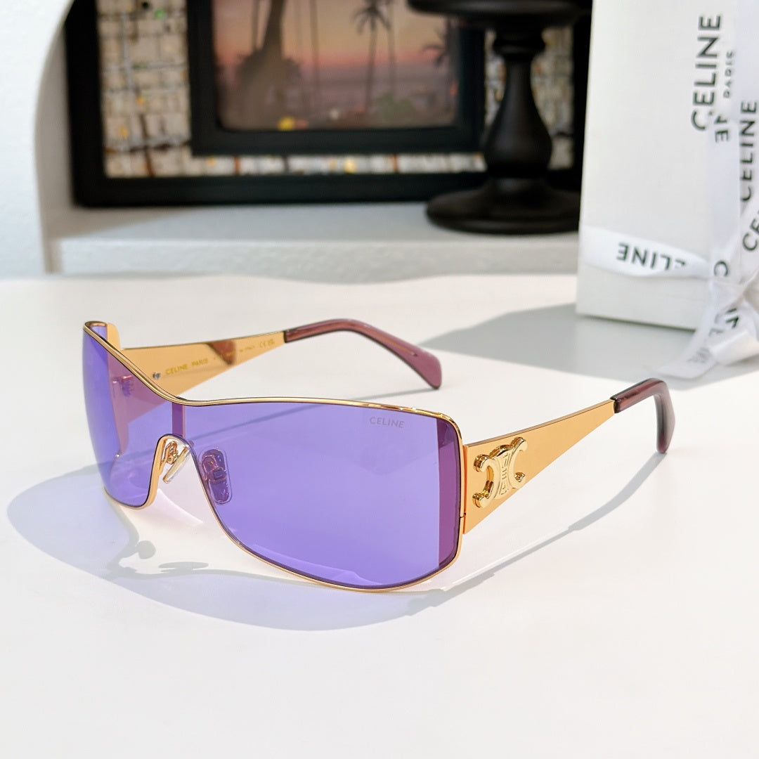 Celine sunglasses with gold frame and purple tinted lenses, cat-eye shield shape