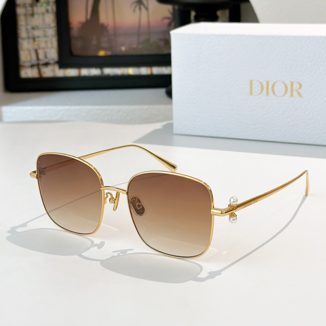 Dior sunglasses with gold frame and tan gradient lenses, square cat-eye style