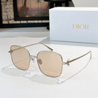 Dior sunglasses with gold frame and light beige gradient lenses, square cat-eye style