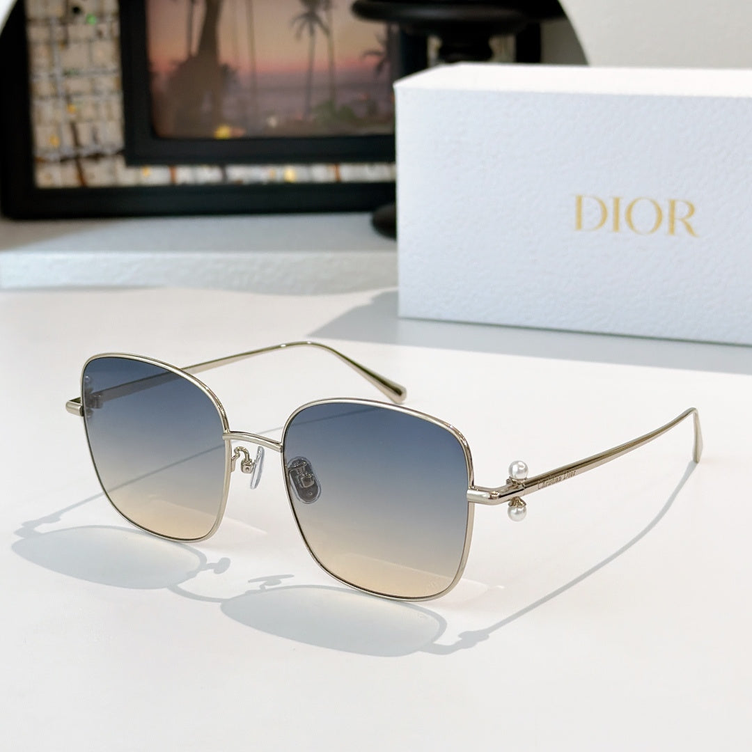 Dior sunglasses with silver frame and blue-gray gradient lenses, square cat-eye style