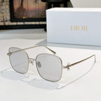 Dior sunglasses with silver frame and light gray gradient lenses, square cat-eye style