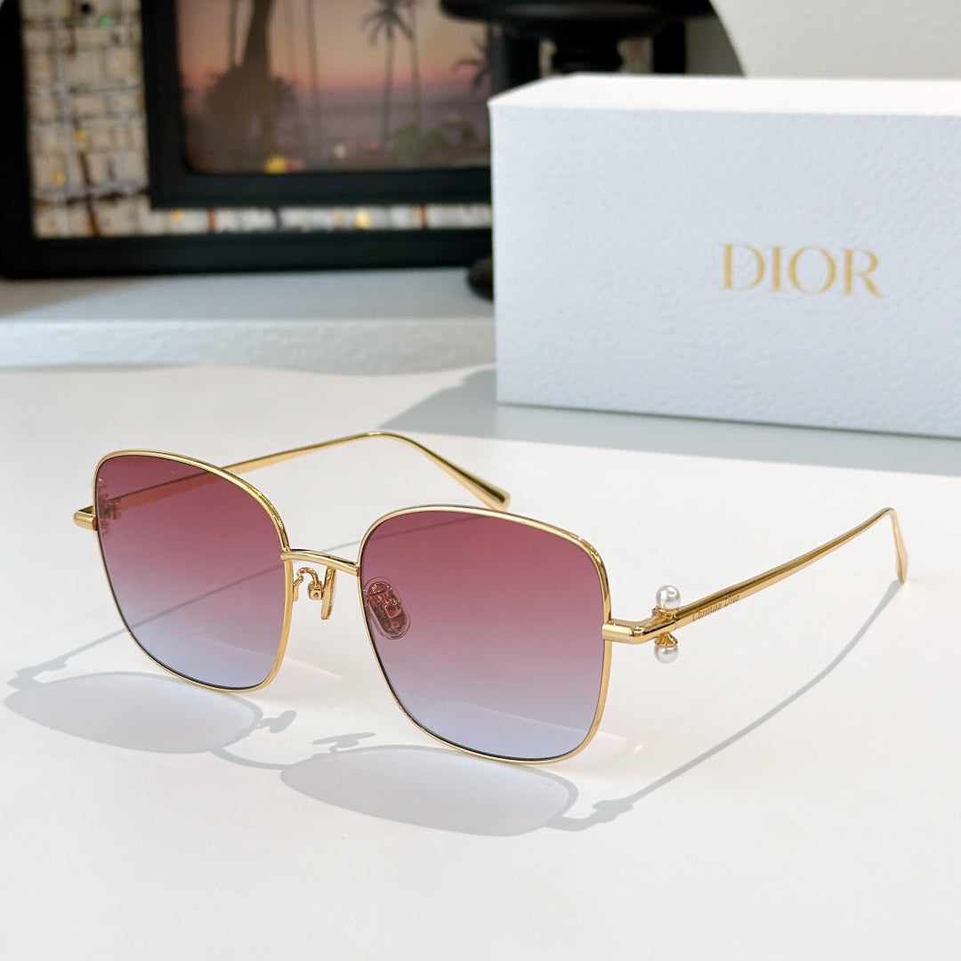 Dior sunglasses with gold frame and pink-purple gradient lenses, square cat-eye style