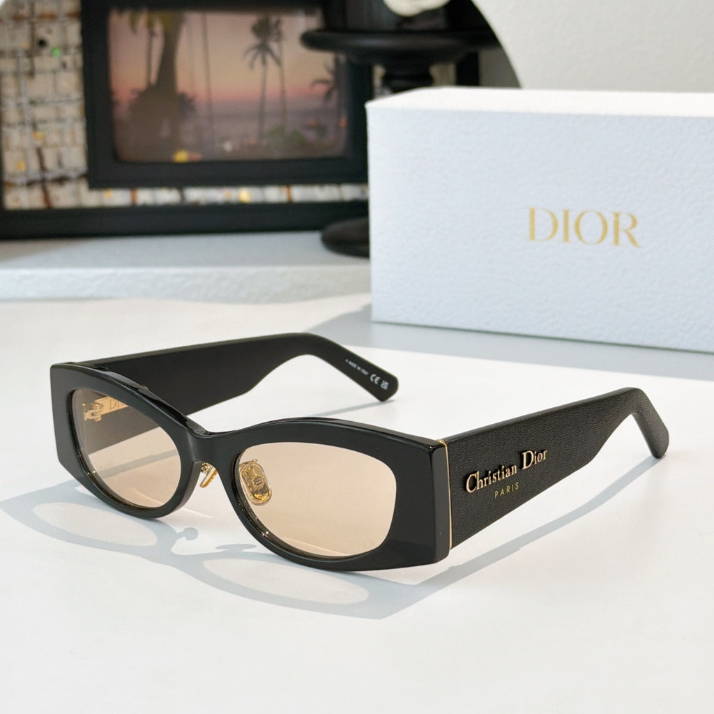 Dior cat-eye sunglasses with black frames and light-tan lenses