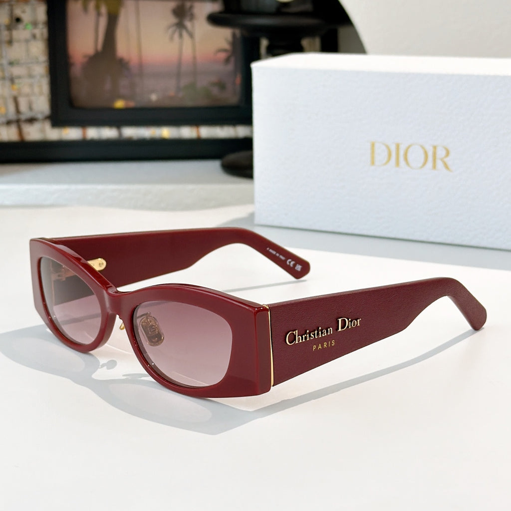Dior cat-eye sunglasses with red frames and pink-tinted lenses