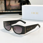 Dior cat-eye sunglasses with dark frames and purple-tinted lenses